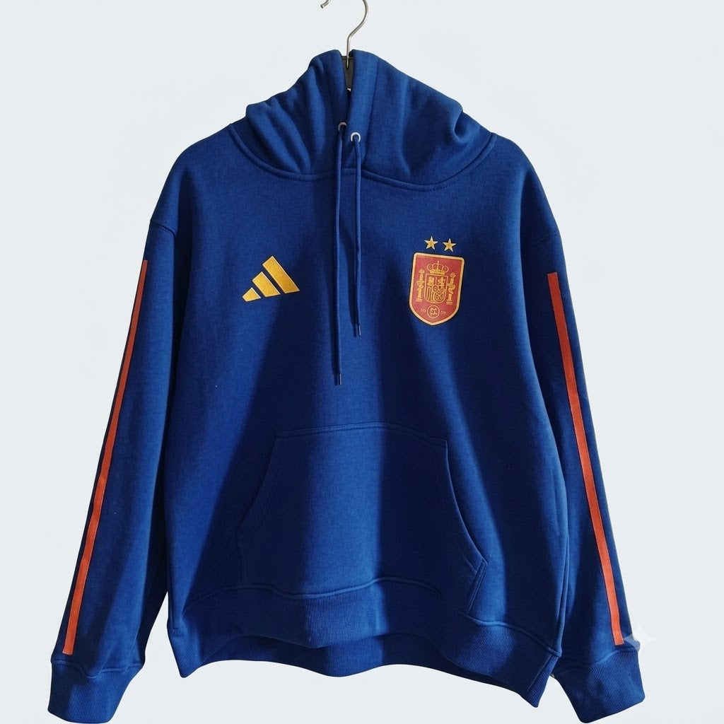 The 2026/27 Team Hoodie - Blue/Red combines -inspired football identity with a comfortable everyday silhouette.