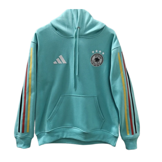 The 2026/27 Team Hoodie - Turquoise/ Tricolor combines national-team style with a comfortable everyday silhouette. A turquoise hoodie accented by black, red, and yellow sleeve striping.