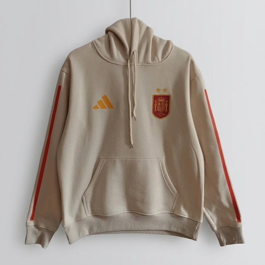 The 2026/27 Team Hoodie - Beige/Red combines -inspired football identity with a comfortable everyday silhouette.
